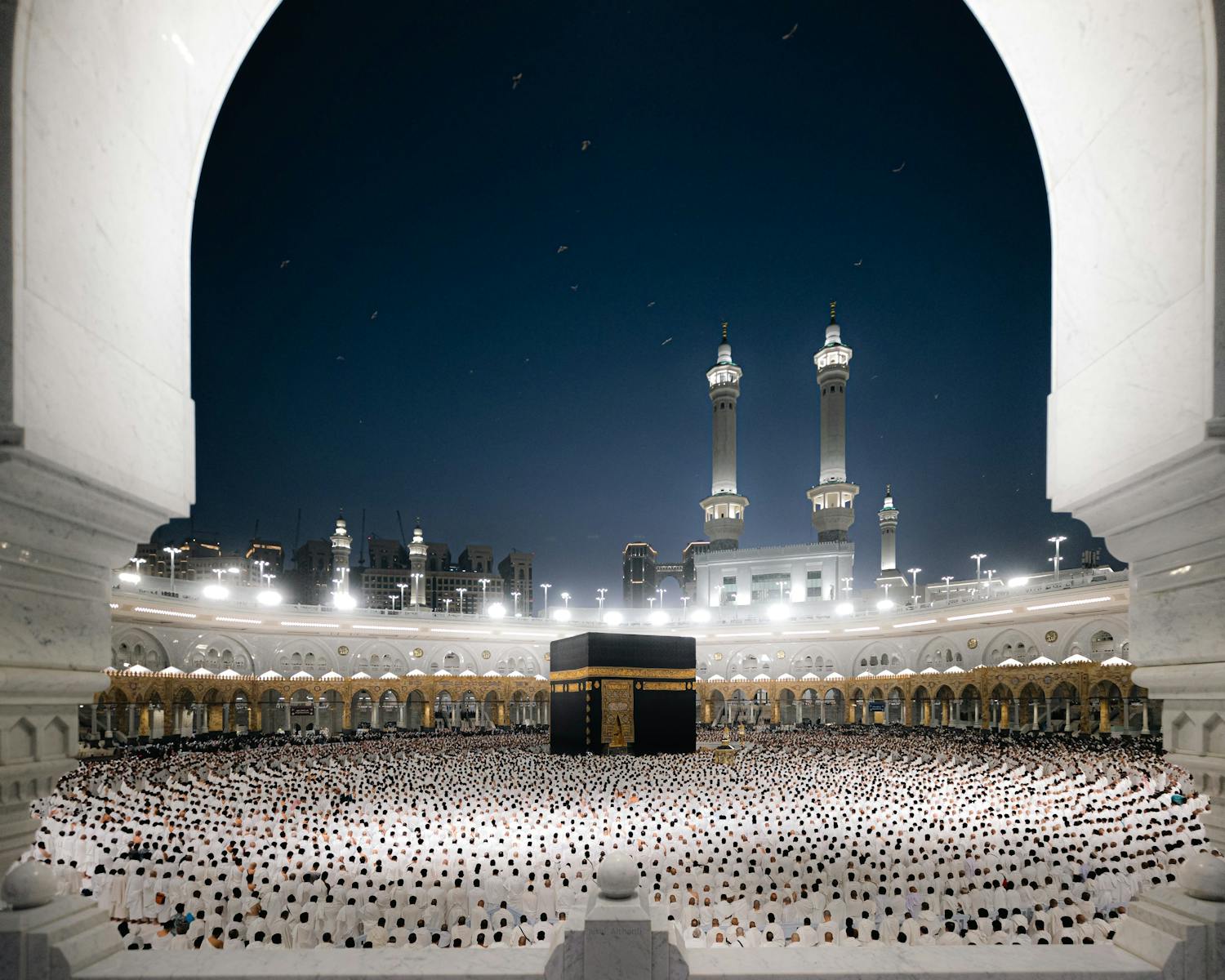 A breathtaking night view of pilgrims at the Kaaba in Masjid al-Haram, Makkah, Saudi Arabia.